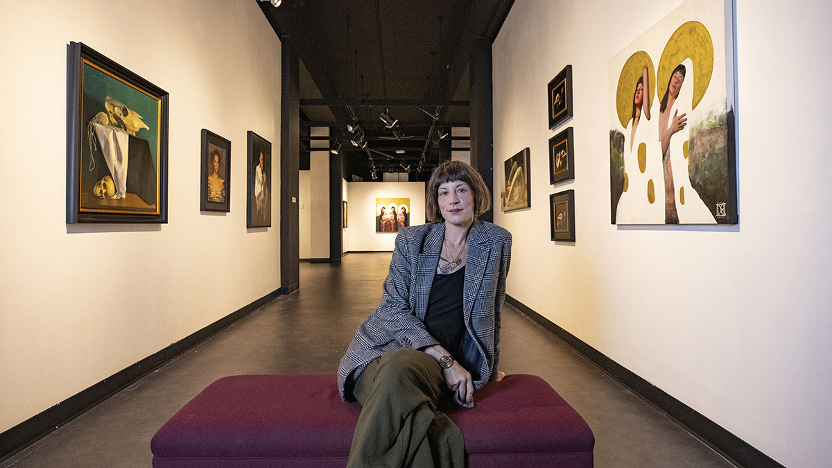 Destiny Bowman sits in the Sharp Museum surrounded by her works on display as part of "Alter Ego"